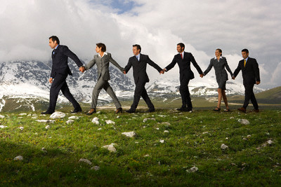 Business People Holding Hands and Walking